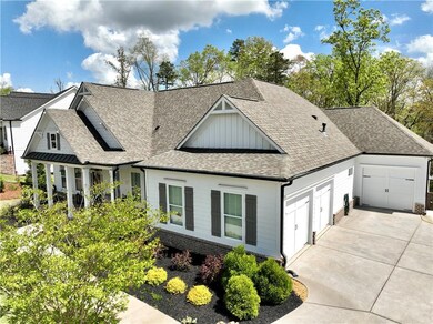 View of front facade featuring concrete driveway, 