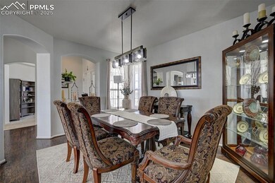 Living room with arched walkways, recessed lightin