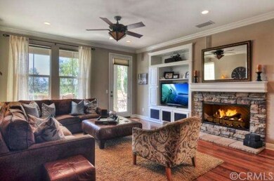 Family room with media niche and stone fireplace