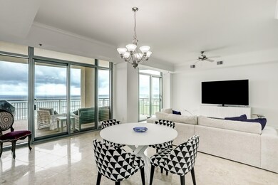 Open concept living/dining/kitchen with balconies