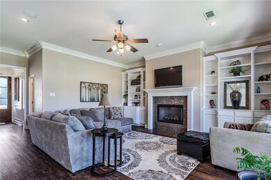 Open living room overlooking the meticulous back y