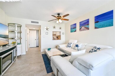 Living room with baseboards, visible vents, and a 