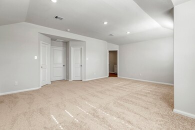 The expansive, primary bedroom is the perfect plac