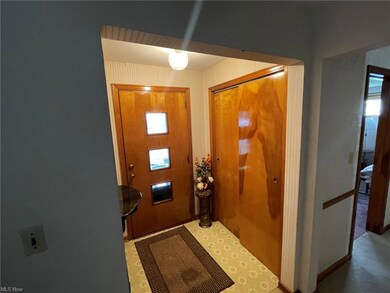 View of carpeted foyer entrance