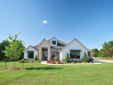 View of front of home featuring a front yard, brick siding, and a shingled roof