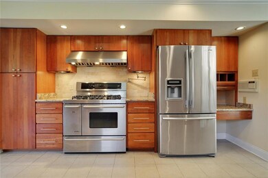 Stainless Kenmore Elite appliances, cherry cabinet