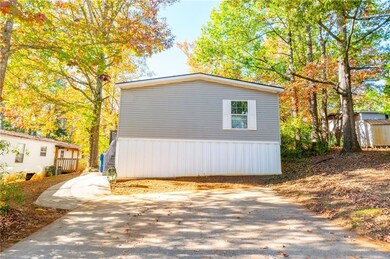 View of property exterior off the 2 car parking pa