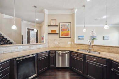 The kitchen features granite counters, chocolate c