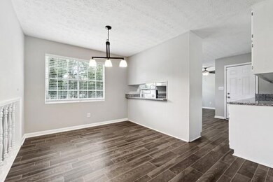 Unfurnished dining area featuring dark wood-style 