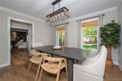 Dining space with ornamental molding, hardwood / w