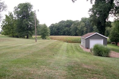 Behind the garage, sits another garage/shed.