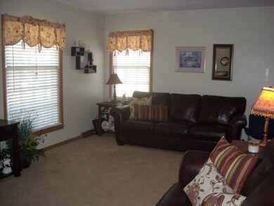 Spacious living room freshly painted.