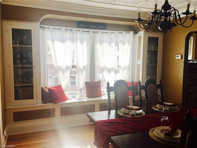 Classic Lakewood Detail and Charm with shining hardwood floors and Built in Dining Room Cabinets.