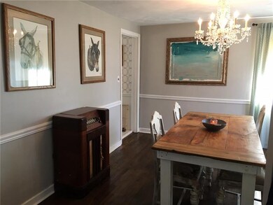 Quaint dining area with  hardwood flooring