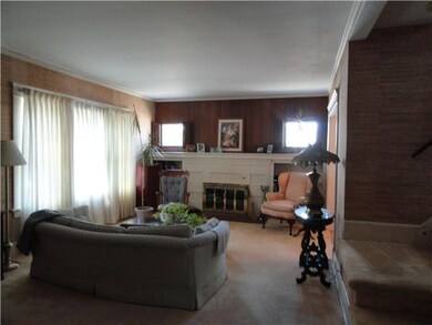 Living Room. Woodburing fireplace with bookshelves
