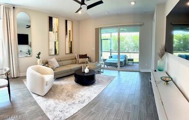 Living area with ceiling fan, tile floors, and recessed lighting