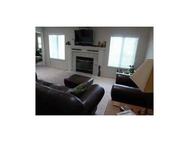 Living room is spacious and gets the morning sun.