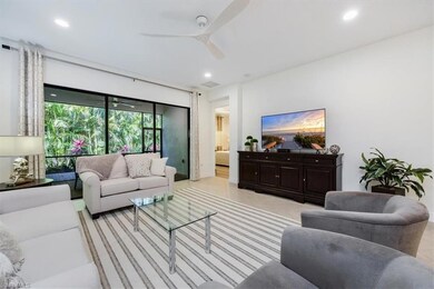 Living area with light tile patterned flooring, a 
