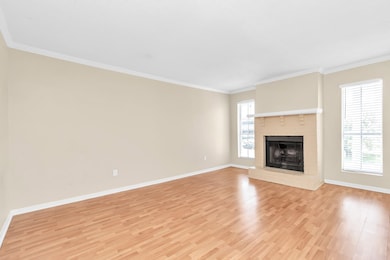 antoher view of the living room with fireplace