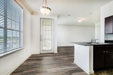 Dining area off Kitchen looking at Balcony door.