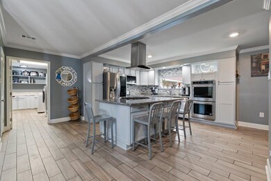 Kitchen featuring appliances with stainless steel 