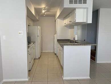 Galley Kitchen, washer and dryer connections are l