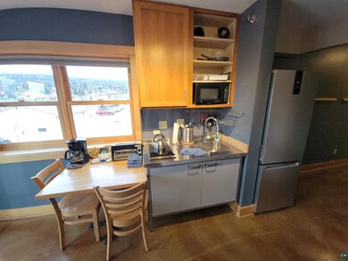 Kitchen featuring stainless steel fridge and sink