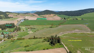 Aerial view of sparsely populated area with a mountainous background