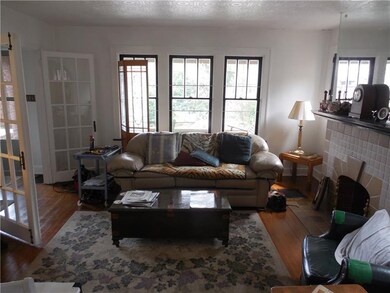 Living room with French doors opening off entryway