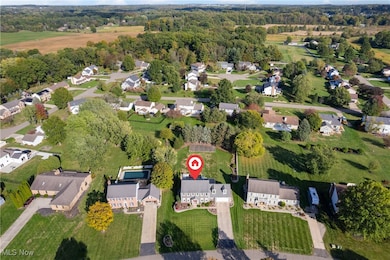 Aerial overview of property's location with nearby suburban area
