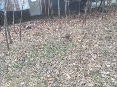 There is a drilled well to the front, unknown cond