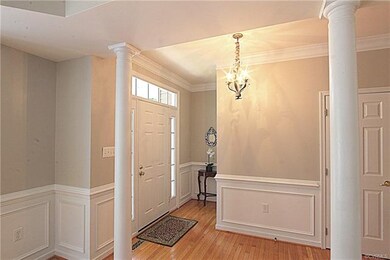 Beautiful Entry Foyer and Hallway with Stately Col