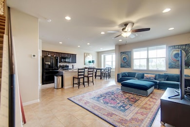 Living area featuring light tile patterned floors