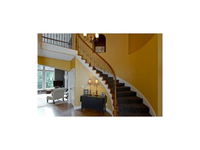 Curved Staircase at Entry