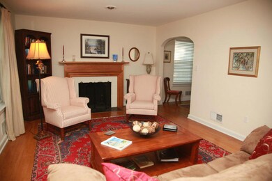 Large well lit Living Room w/ fireplace