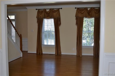 Empty room with crown molding, plenty of natural l