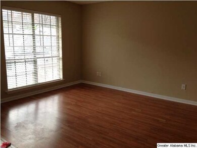 Large rooms with laminate flooring.
