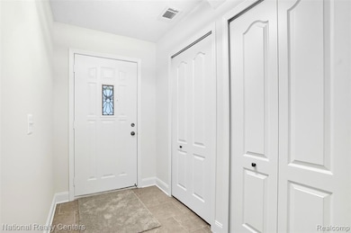 Foyer featuring baseboards