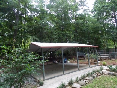 2 Car carport with concrete pad.