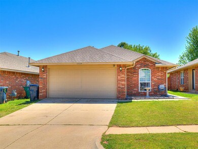 Single story home featuring a shingled roof, concr