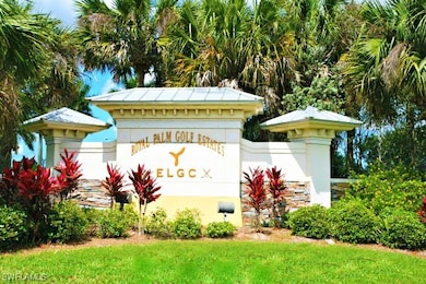 Community / neighborhood sign featuring a lawn