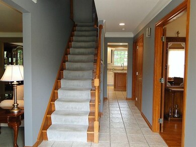 To the right is a den/office with built-ins.