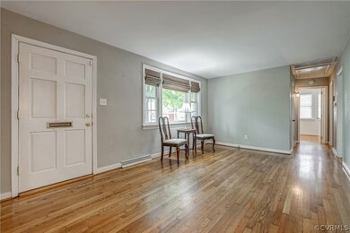 Living Room- Hdwd floors, wood-burning FP