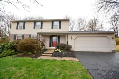 The front yard is nicely landscaped with a level w