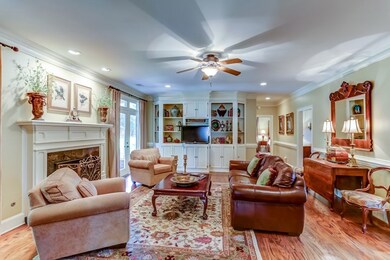 Spacious great room has a vented gas log fireplace