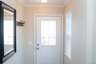 Front Foyer With New Door And Crown Molding!