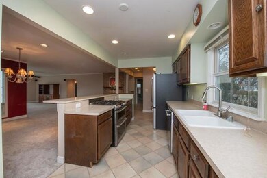 Kitchen - Open view to dining room, fireplace, den