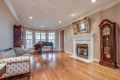 Beautiful living room in the heart of the home. Notice the great bay window, gas fireplace, and recessed lighting. Neutral walls and hardwoods mean it is move in ready!