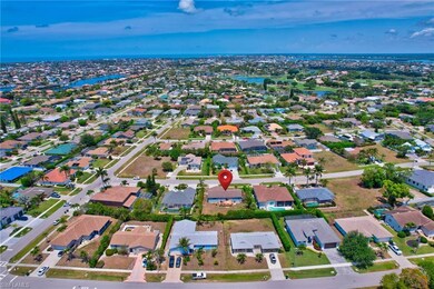 Birds eye view of property with a water view and a