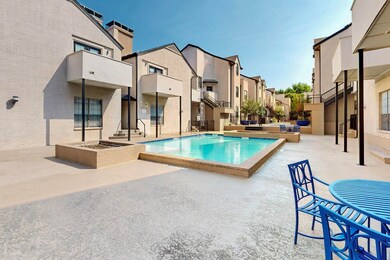 Community pool with a patio